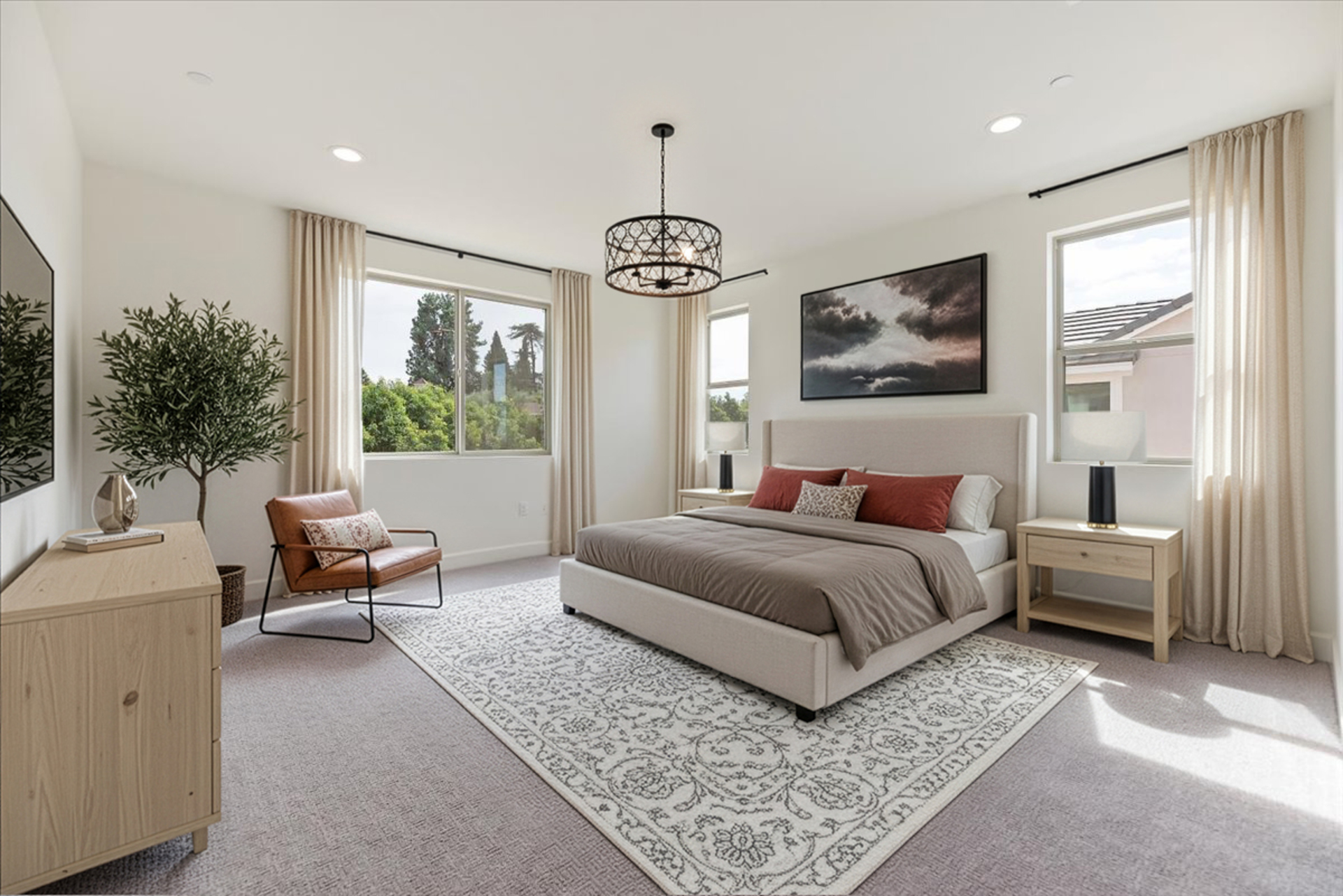 primary bedroom with neutral carpet and large windows
