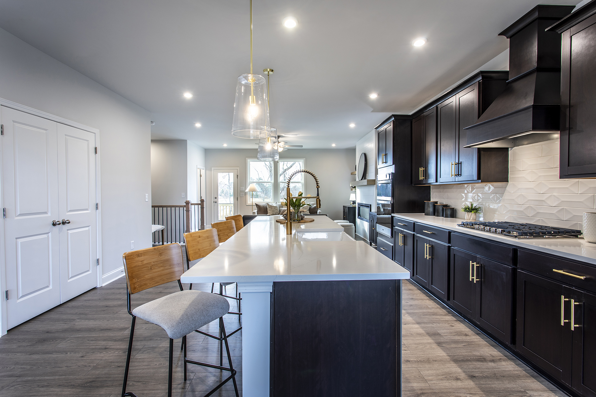 kitchen with dark cabinets and quartz counters